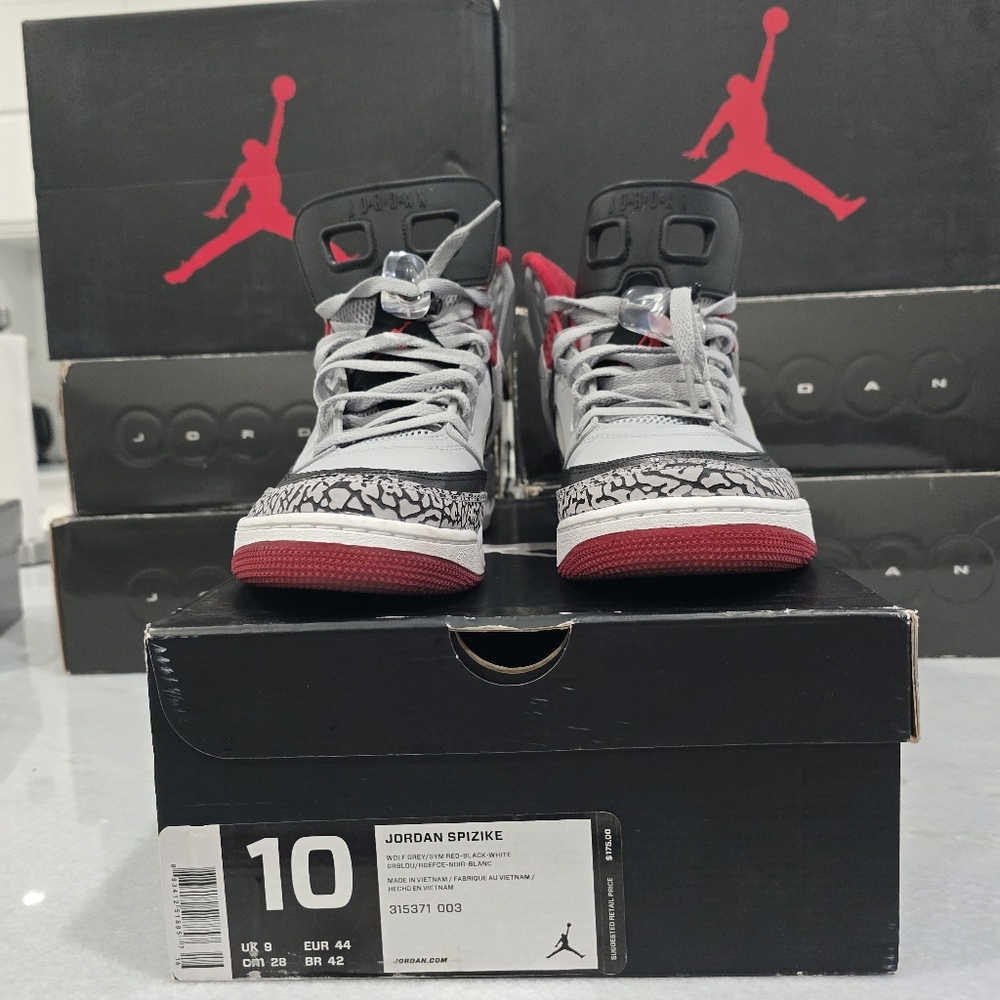 This is a pair of Air Jordan Spizike in the 'Wolf Grey/Gym Red' colorway. 